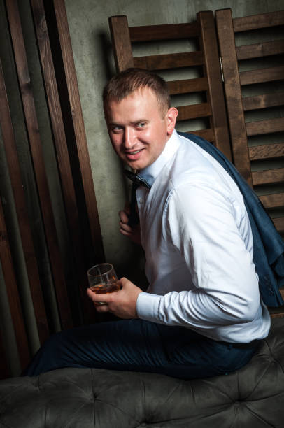 istock Luxury groom in a wedding suit in a beautiful interior room 1161022084