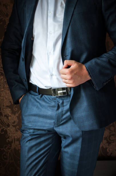 istock Luxury groom in a wedding suit in a beautiful interior room 1161022186