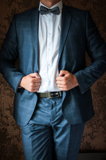 istock Luxury groom in a wedding suit in a beautiful interior room 1161022257