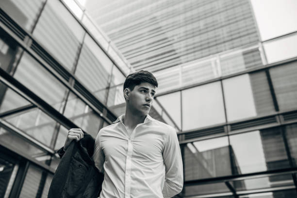 istock Handsome businessman putting jacket on 1161025265