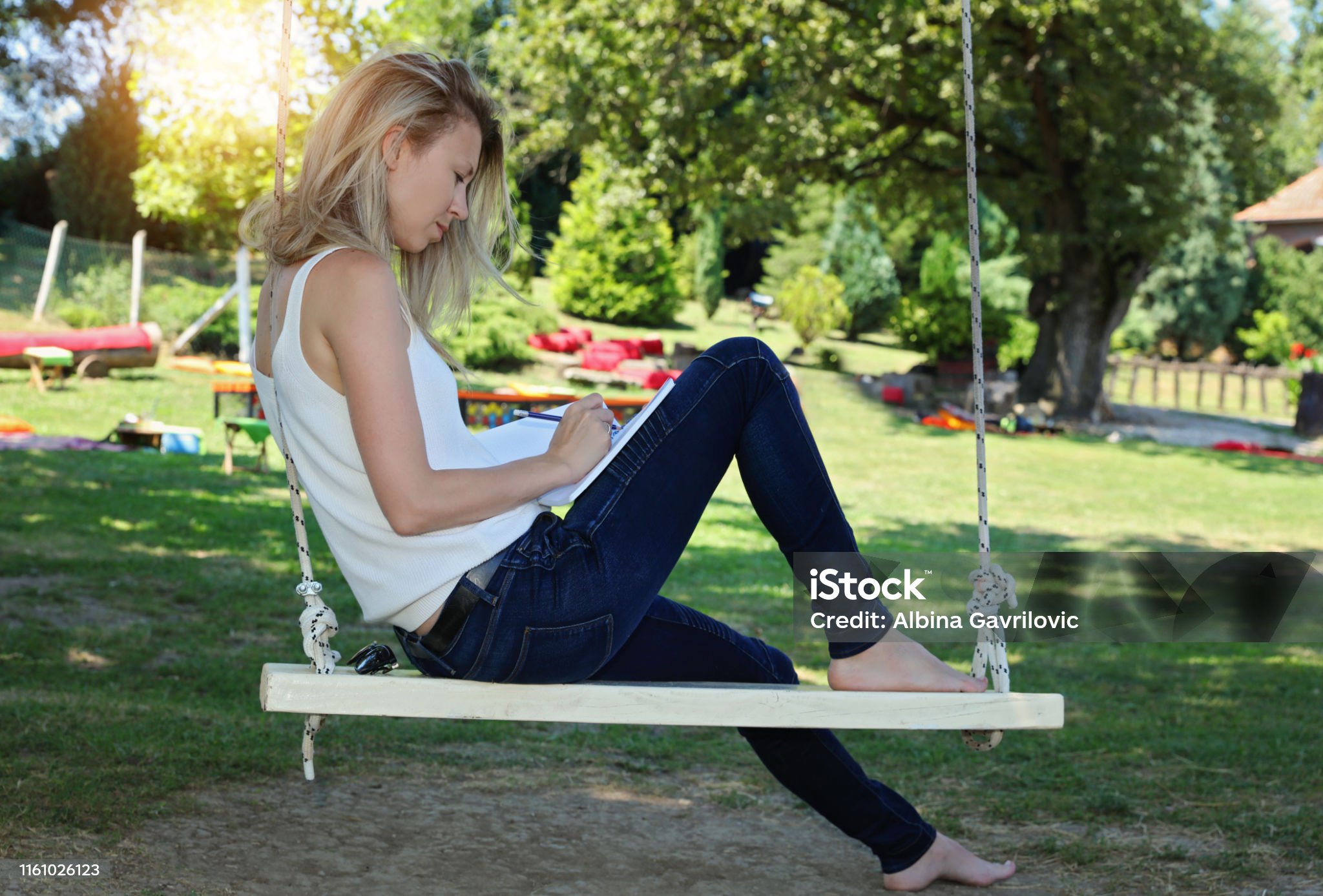 https://media.istockphoto.com/id/1161026123/photo/student-learning-outdoors-preparing-to-exams-woman-sitting-on-old-swing-under-the-tree-and.jpg?s=2048x2048&w=is&k=20&c=qv73xljAkjXpMR0YrQJVMmNUQFOMQpRNEWek1waqtXw=