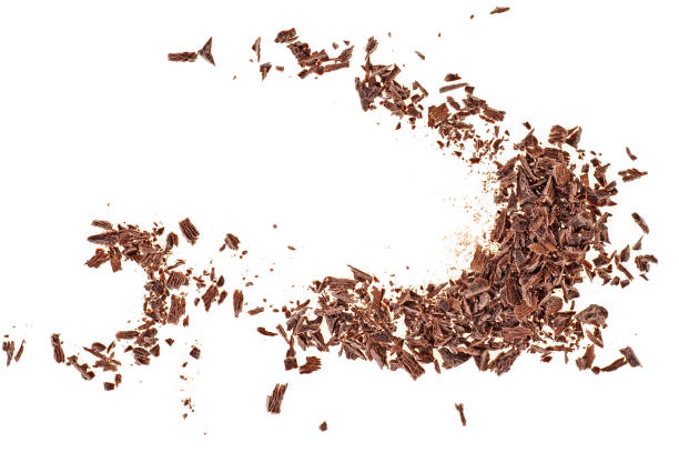 Pieces of chocolate on a white background, top view.