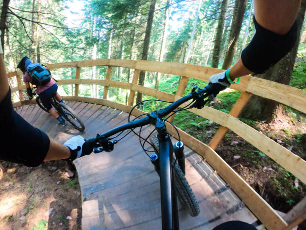istock Man and woman mountain biking 1161030819