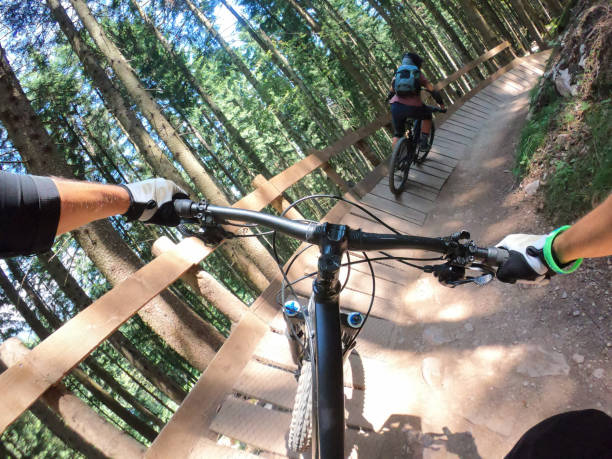istock Couple mountain biking in forest 1161030855