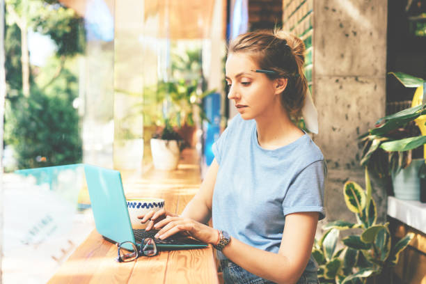 istock girl with laptop in cafe 1161033194