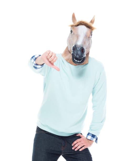 istock Man with horse mask who is showing thumbs down 1161035239