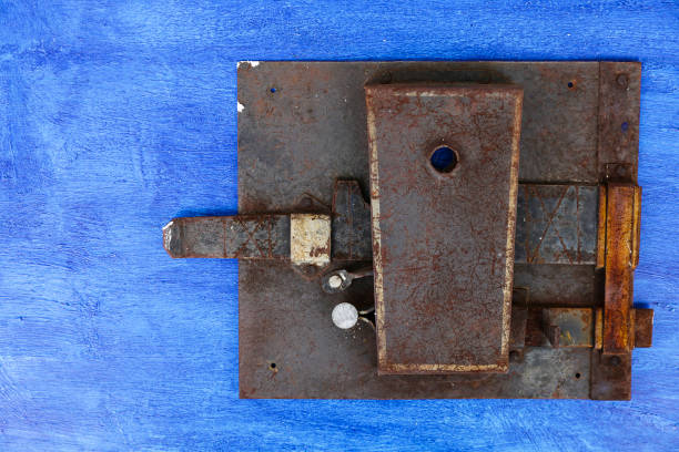 metal rusty old lock on the door. blue old board and lock