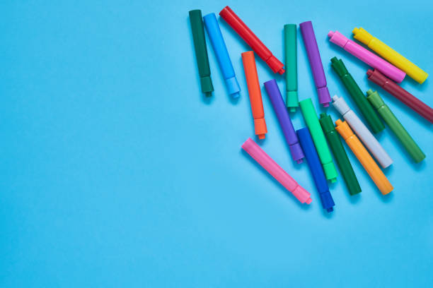 istock Colored felt tip pens on light blue background with place for text. Top view, copy space 1161038045