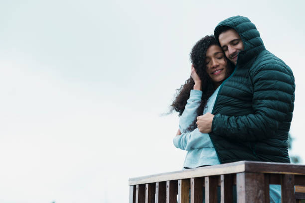 istock Couple embraced on a balcony after trekking 1161038981