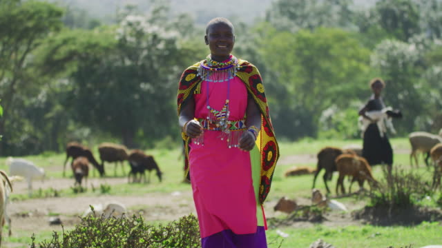 Maasai woman smiling and dancing