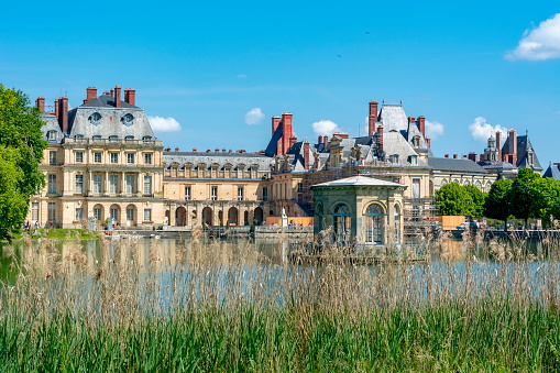 France - May 2018: Fontainebleau palace (Chateau de Fontainebleau) and park near Paris