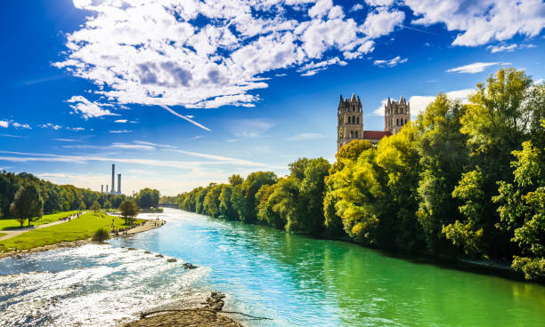 View on summer landscape by St. Maximilian church and Isar in Munich stock photo