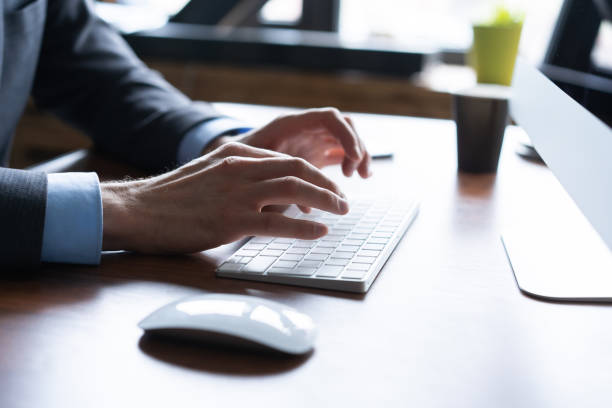 istock Business man using laptop computer. Male hand typing on laptop keyboard. 1161040899