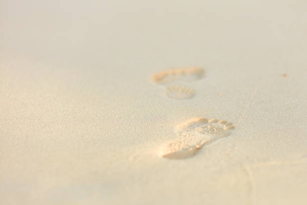 istock Footprints in the sand - summer vacation 1161041654