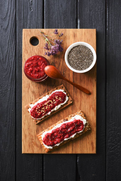 istock and ricotta on wholegrain crispbread on black background 1161042869