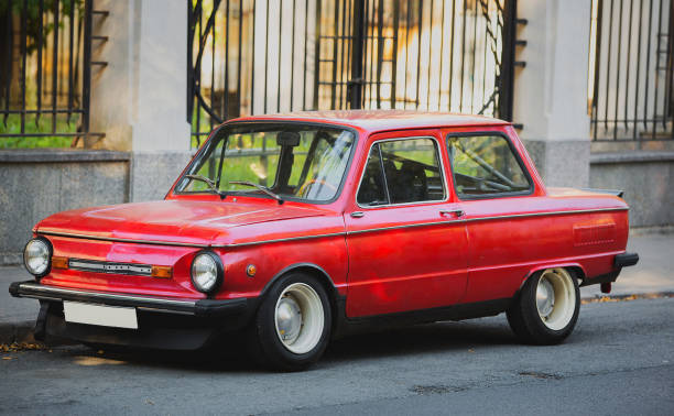 istock Red tuned retro car parked on the road 1161046343