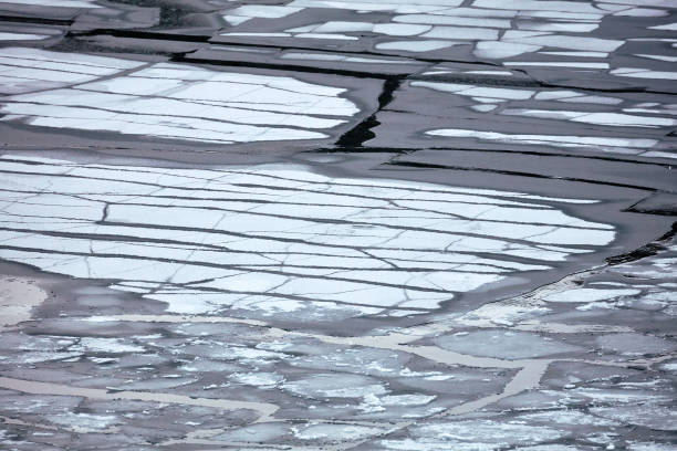istock ice on the pond. water freezing 1161046458