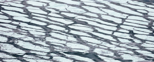 istock ice on the pond. water freezing 1161046694