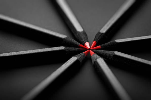 Red and black colored pencils. stylish business concept, on black background