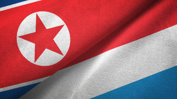 istock North Korea and Luxembourg two flags textile cloth, fabric texture 1161047108