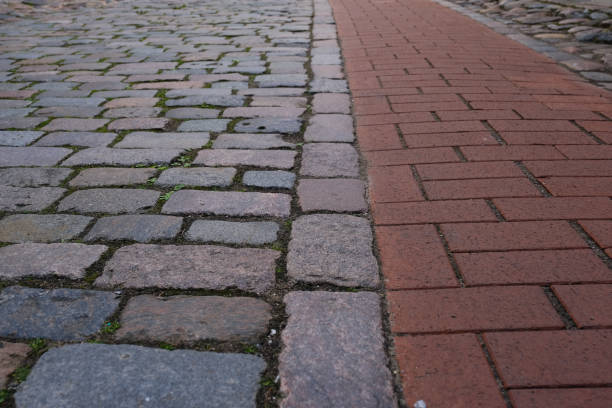 istock closeup old pebble pavement with two kinds of cobblestone 1161047806