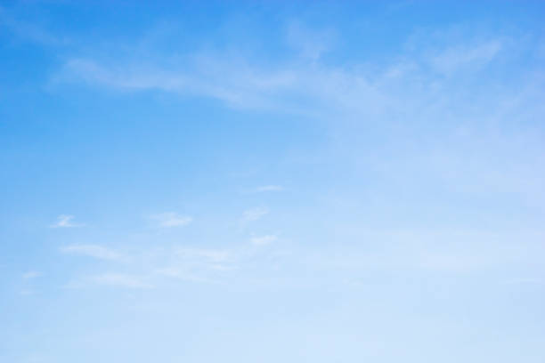 istock Fluffy blue sky background and white clouds soft focus, and copy space 1161049048