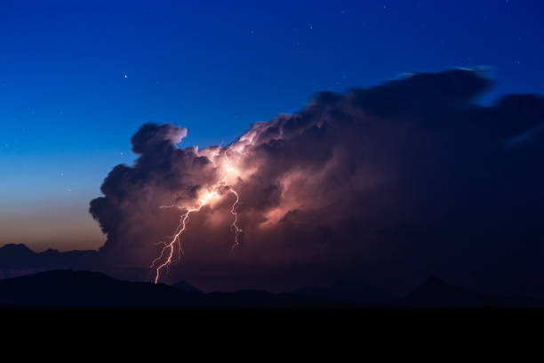 istock Thunderstorm cumulonimbus cloud with lightning 1161049891