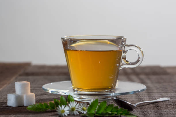 istock Cup of camomile tea with camomile flowers 1161051996