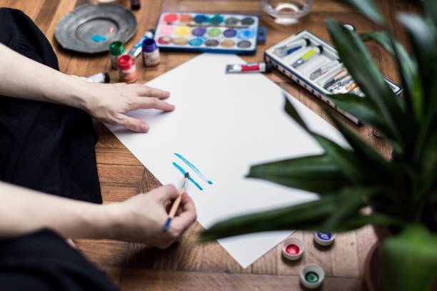 istock Woman painting 1161053471
