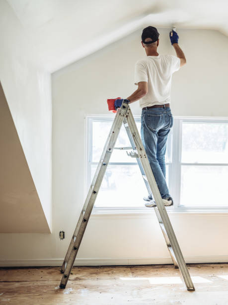 istock Senior man painting apartment interior 1161055565