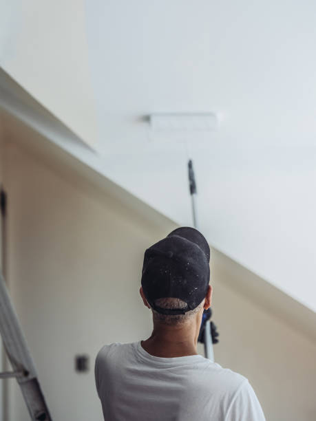 istock Senior man painting apartment interior 1161055697