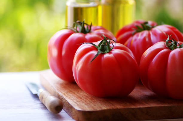 istock closeup of red tomatoes on wooden table 1161057554