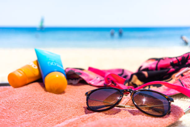 istock towel with different accessories on the beach 1161059764