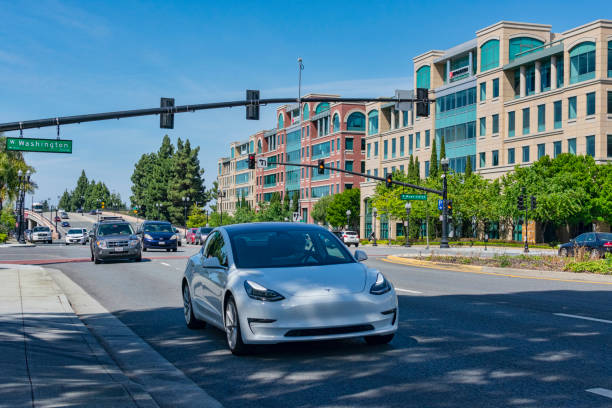 Cars driving on a busy road in Silicon Valley Sunnyvale, California, USA - May 25, 2019: Many cars driving on a busy road in urban city area during day time tesla model 3 stock pictures, royalty-free photos & images