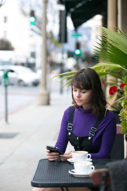 istock Woman Browsing on Social Media While Waiting at Coffee Shop 1161064775