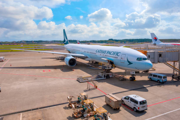 Cathay Pacific flight docks in Narita International Airport Tokyo, Japan - April 30 2018: Cathay Pacific flight docks in Narita International Airport one of  the world's busiest passenger airports narita japan stock pictures, royalty-free photos & images