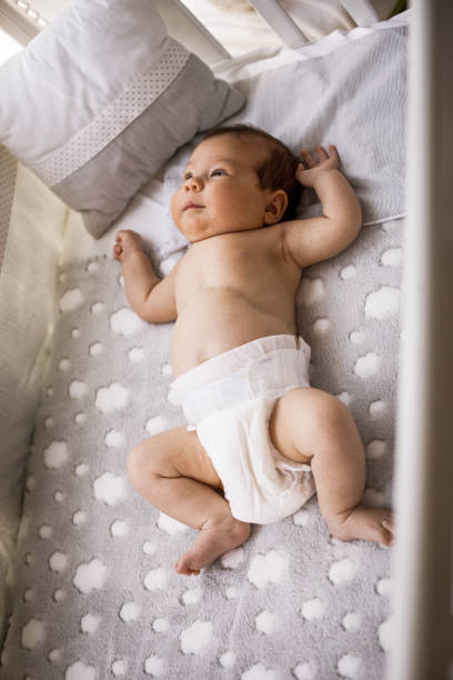 istock Newborn baby resting in her crib 1161068637