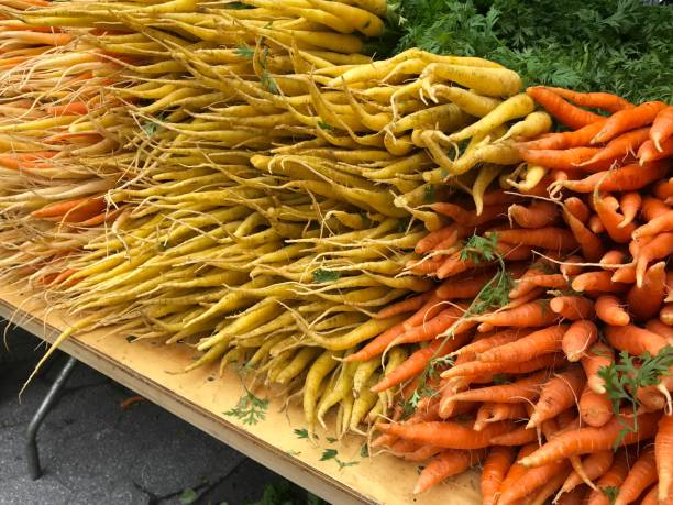 istock yellow and orange carrots 1161068684