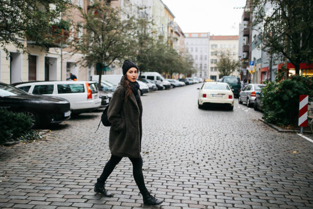 istock Young woman walking in Berlin 1161070305