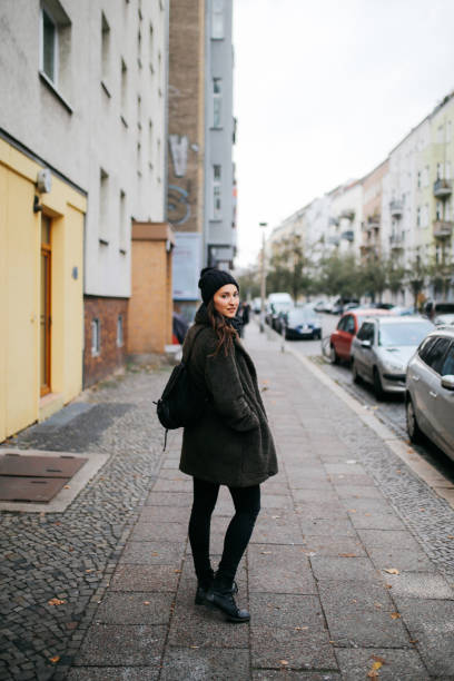 istock Young woman walking in Berlin 1161070321