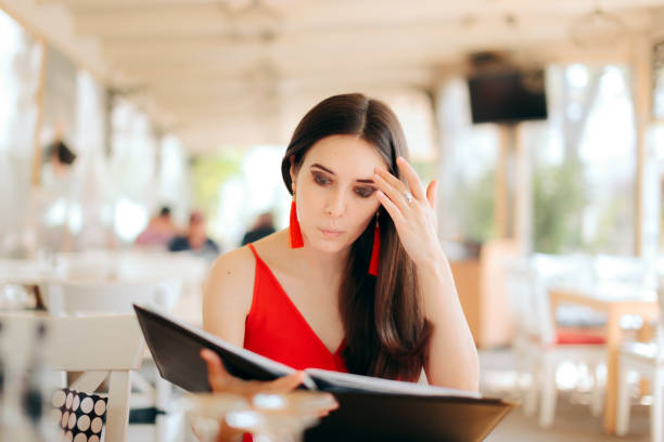 istock Funny Woman Reading Restaurant Menu 1161077508