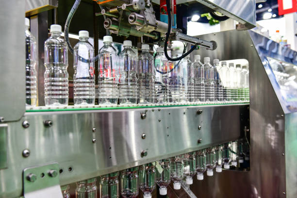 istock Clear plastic Bottles transfer on Automated conveyor systems industrial 1161080334