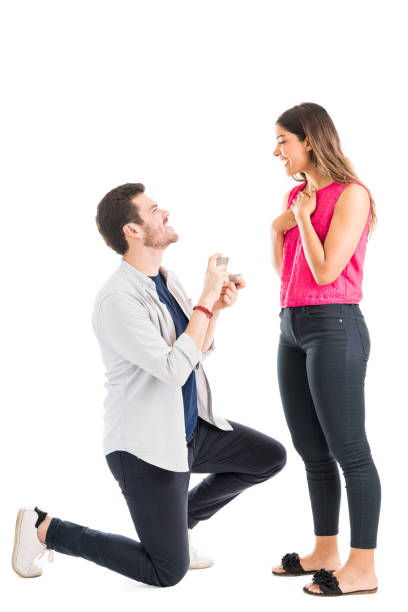 istock Boyfriend Holding Engagement Ring For Woman In Studio 1161080432