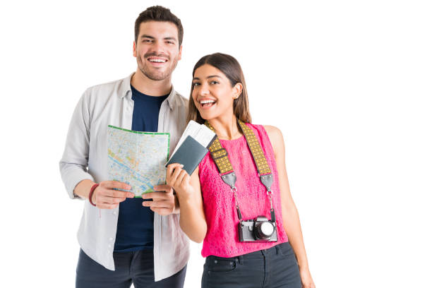 istock Smiling Young Tourists Going On Vacation Against White Background 1161081481