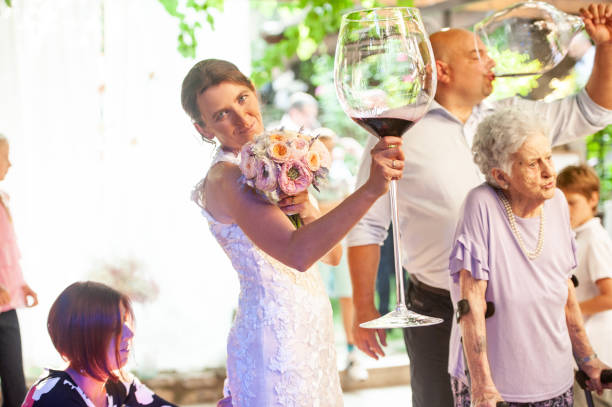 istock Smiling Bride Holding Large Wineglass 1161083927