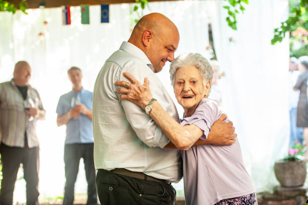 istock Bridegroom Hugging His Smiling Senior Mother 1161083958