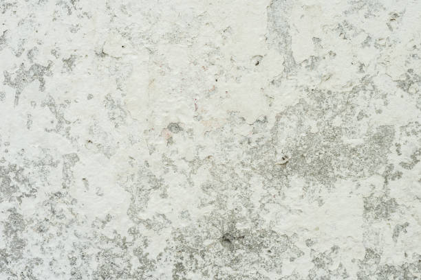 istock Texture of a concrete wall with cracks and scratches which can be used as a background 1161085112