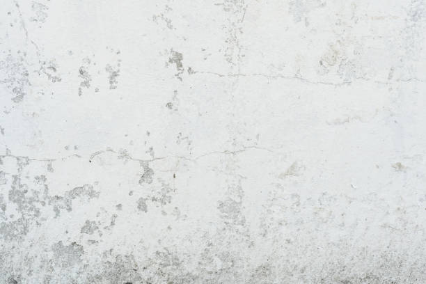 istock Texture of a concrete wall with cracks and scratches which can be used as a background 1161085164
