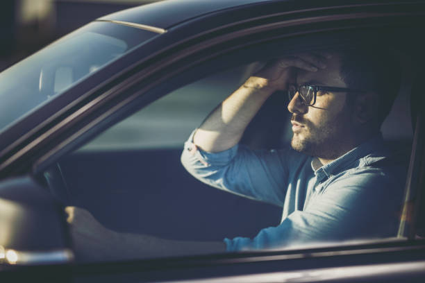 istock Man driving a car and cannot believe what he sees. 1161091049