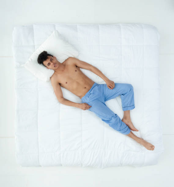 istock Sexy African American man on bed 1161091141